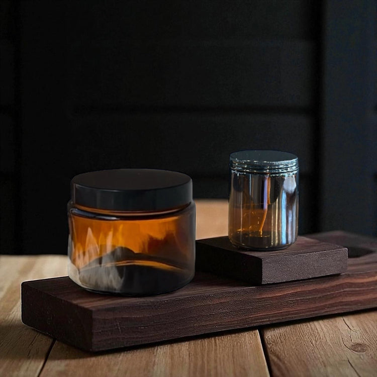 Sealed Collection candle jars – amber with black lids, pearl studded vessels and frosted jars with silver lids. Elegant designs, scents and colours available in Bathurst NSW.