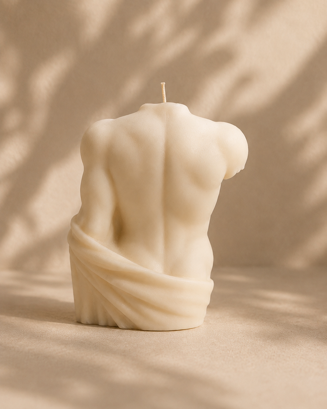 Back view of Natural Soy Draped Male Torso Candle – The Coven Bx